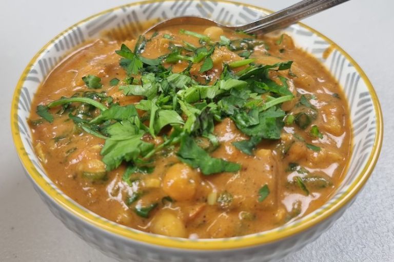 Nutrition Scotland - Chickpea Curry in a bowl with spoon