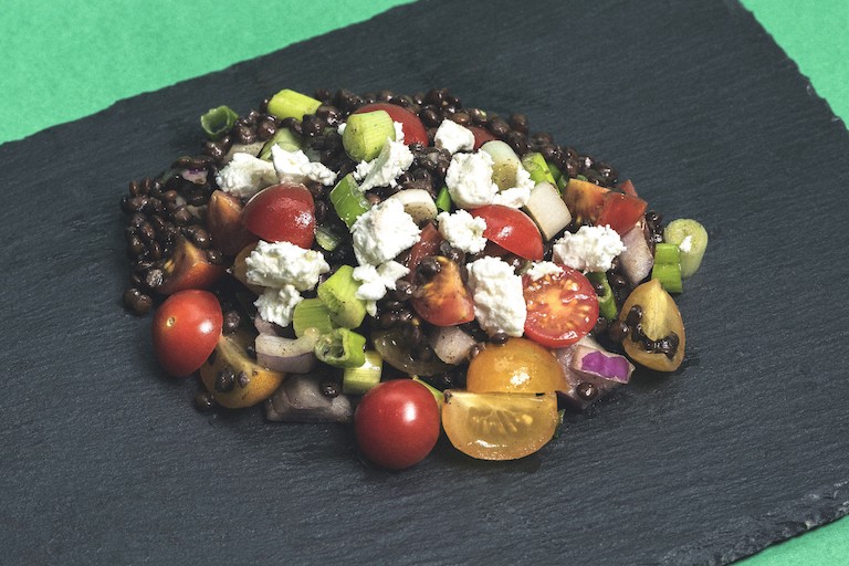 Lentil and Tomato Salad presented on slate